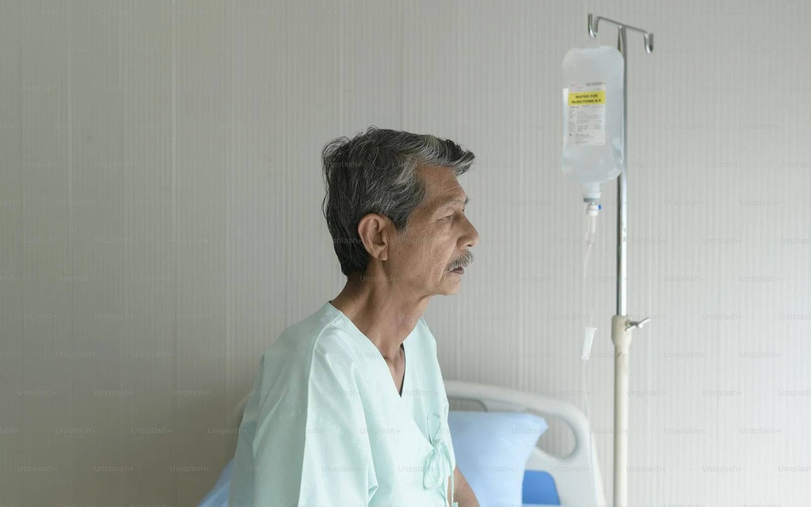 Portrait of senior patient lying on bed in hospital, healthcare and medical concept